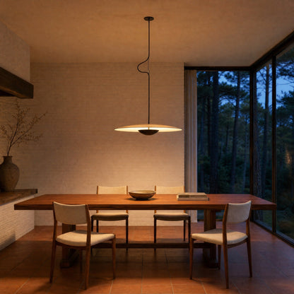 Fenna wood-effect pendant light switched on above a teak table in an architect's dining room | Wickleigh
