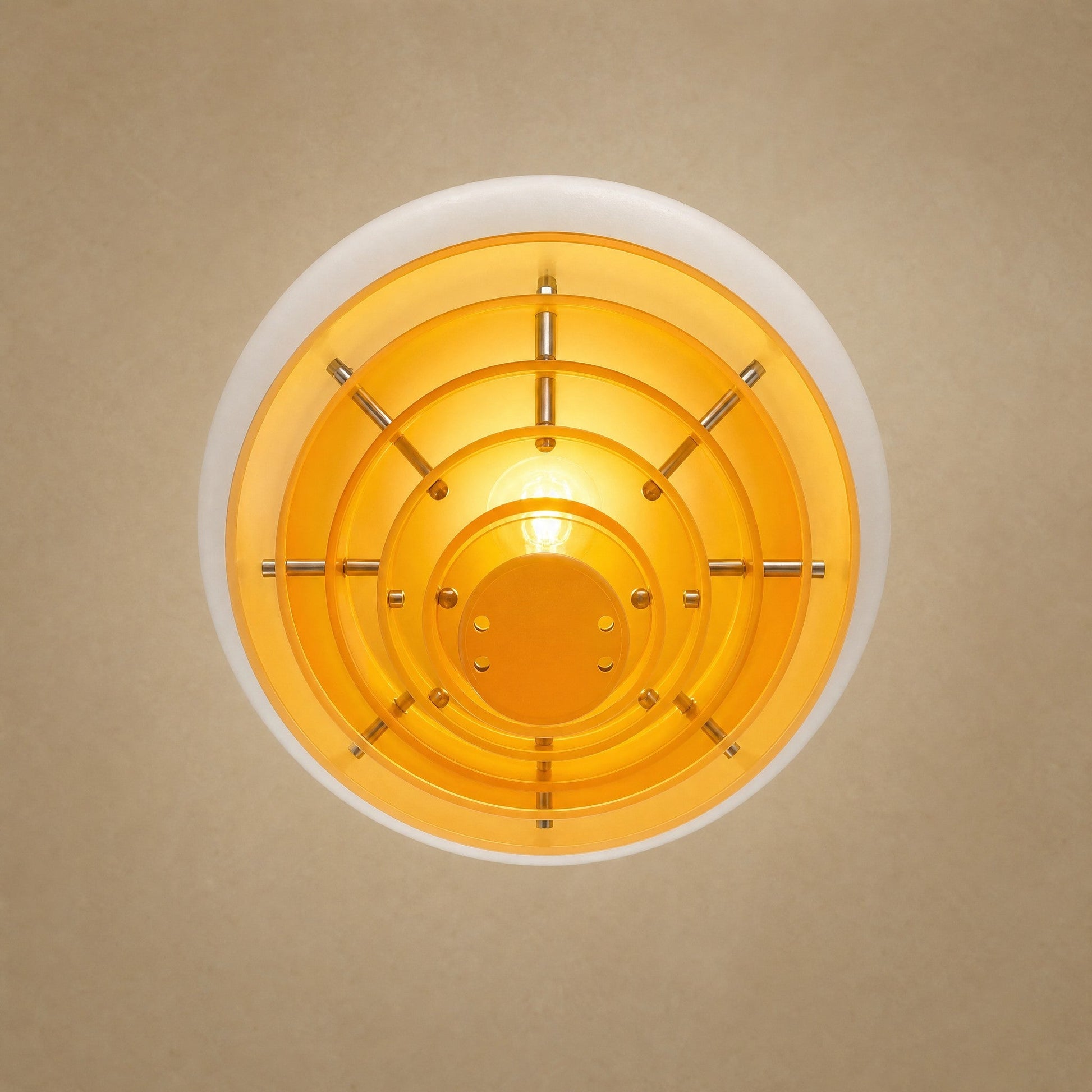 Fenwyn orange pendant light seen from below, six concentric amber discs and E27 bulb | Wickleigh
