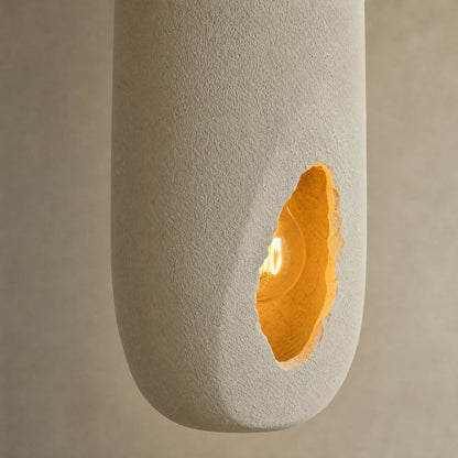 Detail of the sandy texture and amber opening on the Korven pendant light | Wickleigh