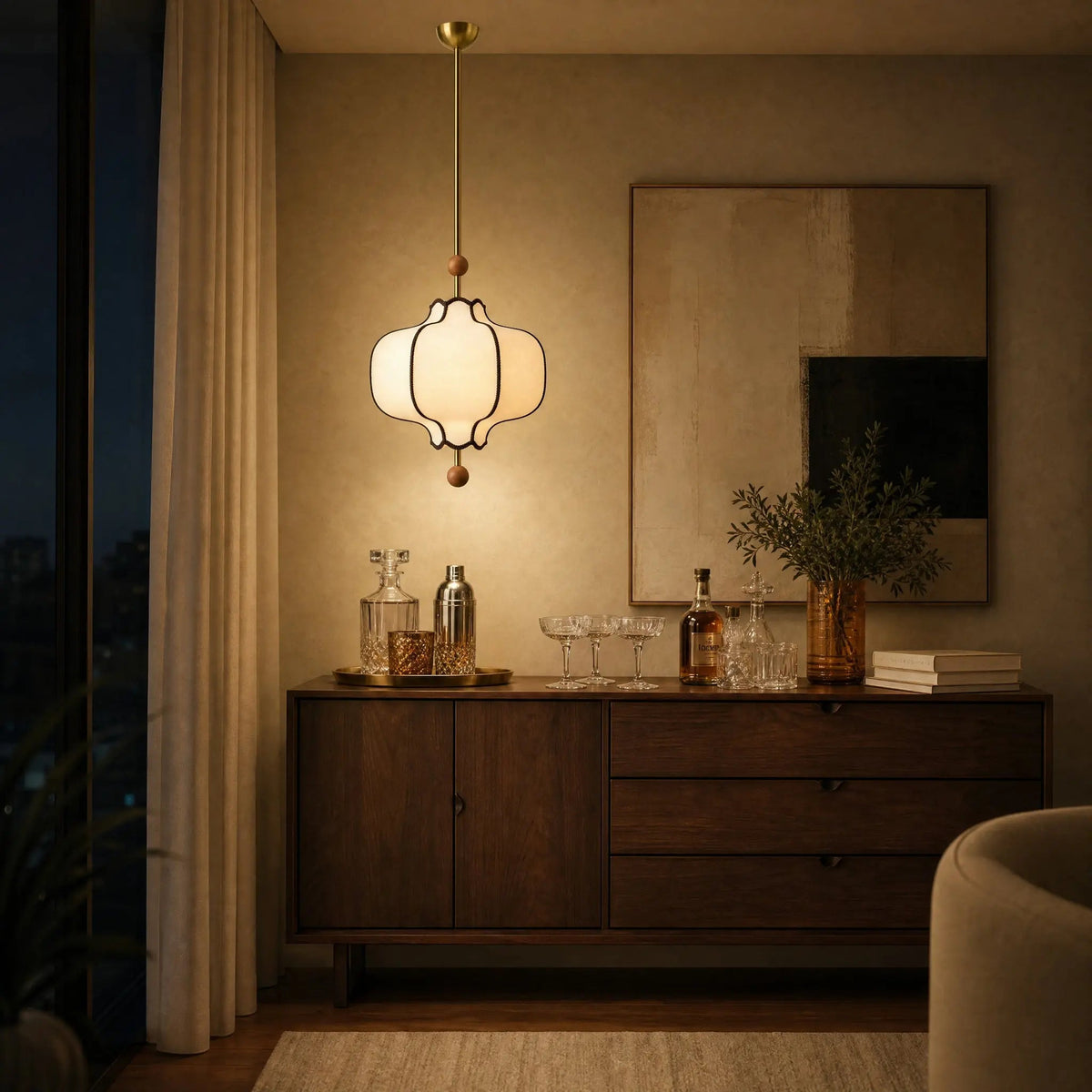 Linne vintage pendant light lit above a walnut home bar | Wickleigh